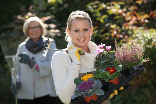 A gardener using adaptive tools along a level garden path